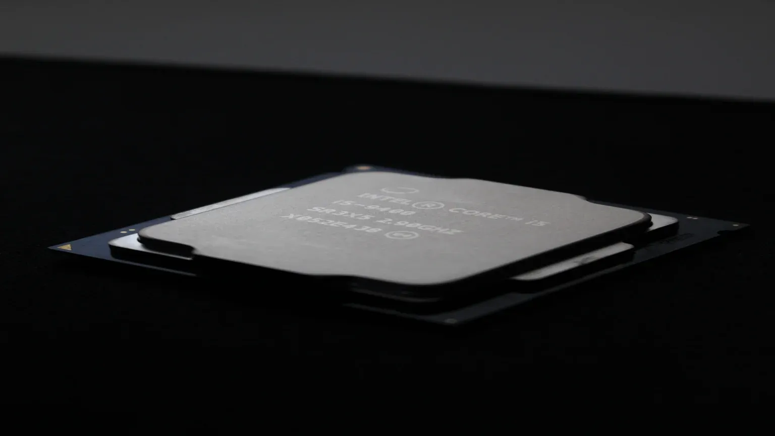 Close-up of an Intel Core Ultra processor chip on a dark background